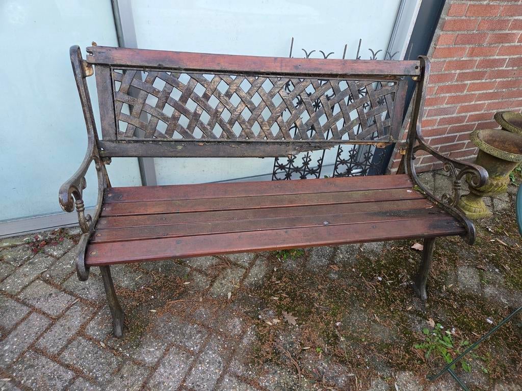 Gietijzeren onderdelen van een tuinbank, Ophalen of Verzenden, Gebruikt, Hout