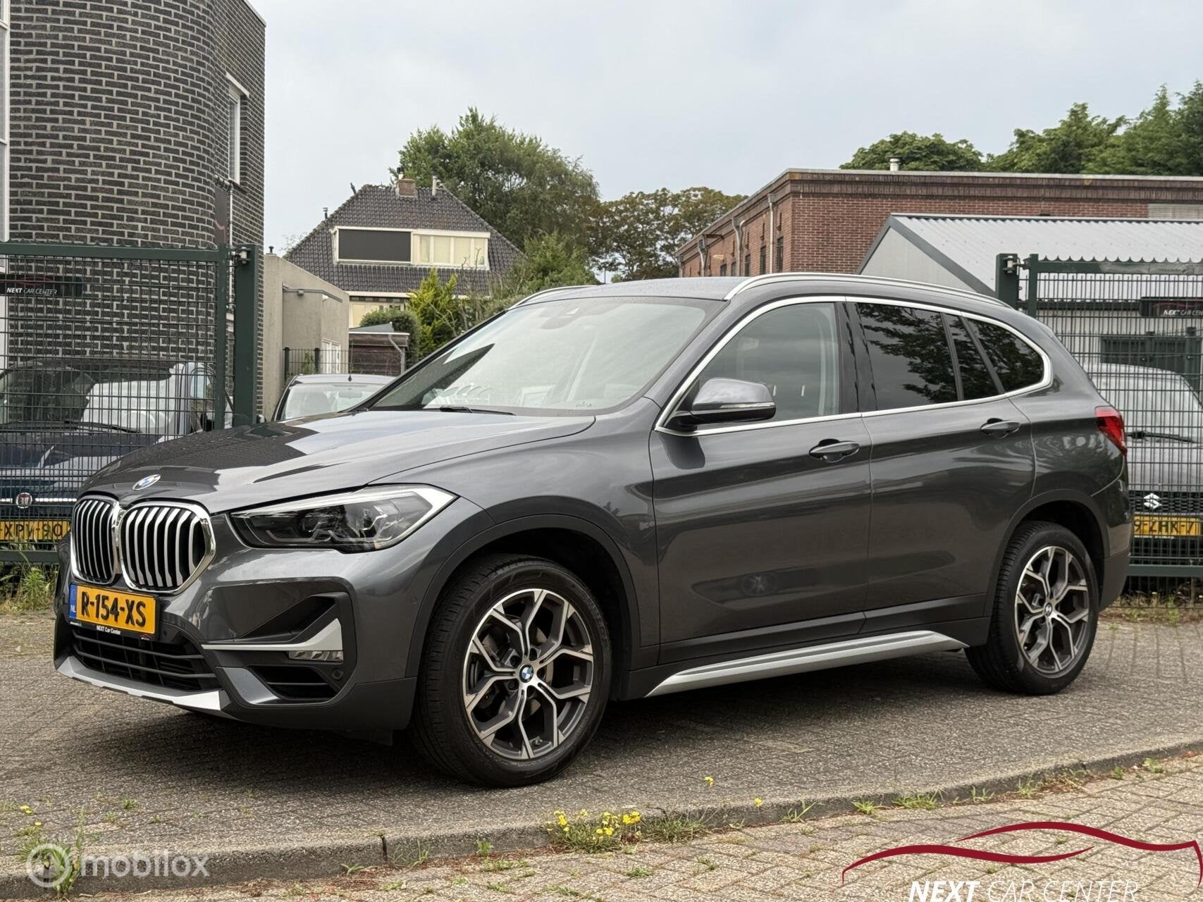BMW X1 sDrive18i High Executive, Auto's, Gebruikt, Euro 6, Leder, 3 cilinders