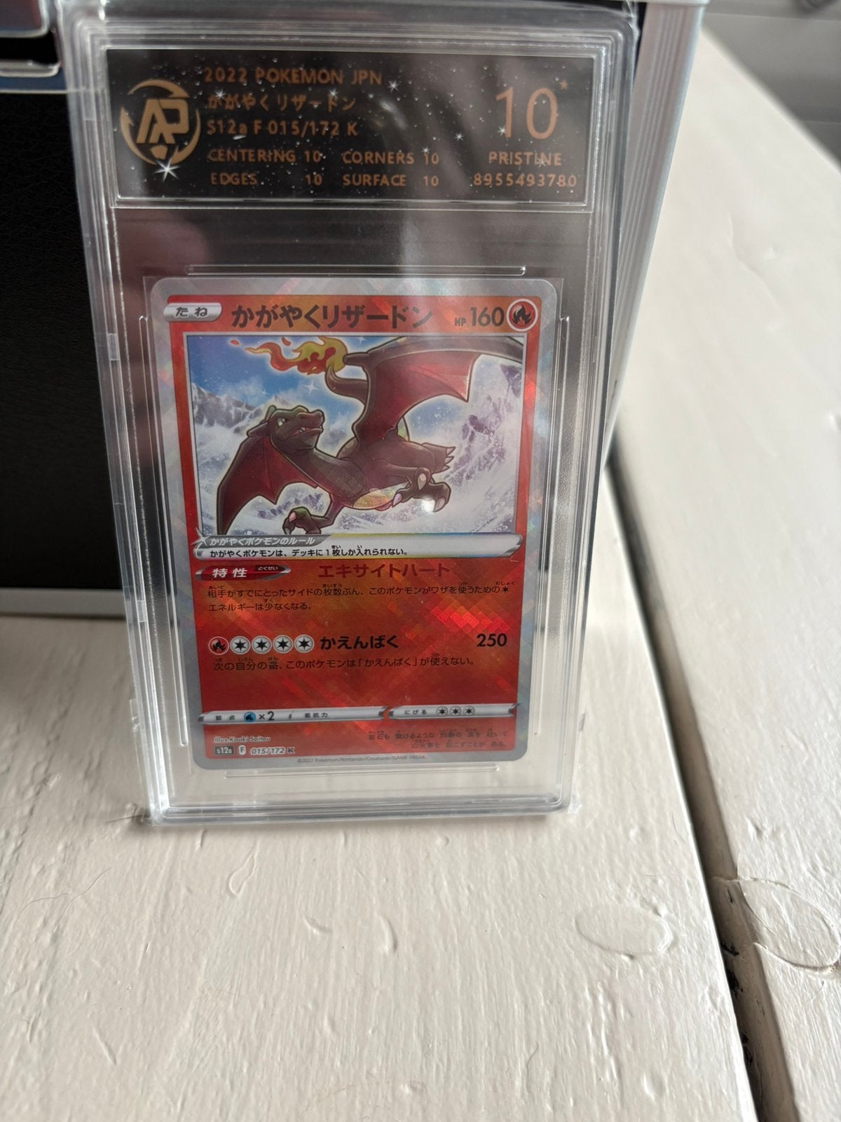 Radiant Charizard grade 10, Ophalen of Verzenden, Zo goed als nieuw, Meerdere kaarten, Foil