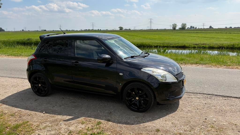 Suzuki Swift 1.2 5-D 2011 Zwart, recente APK + grote beurt, Voorwielaandrijving, Stof, 4 cilinders, 400 kg