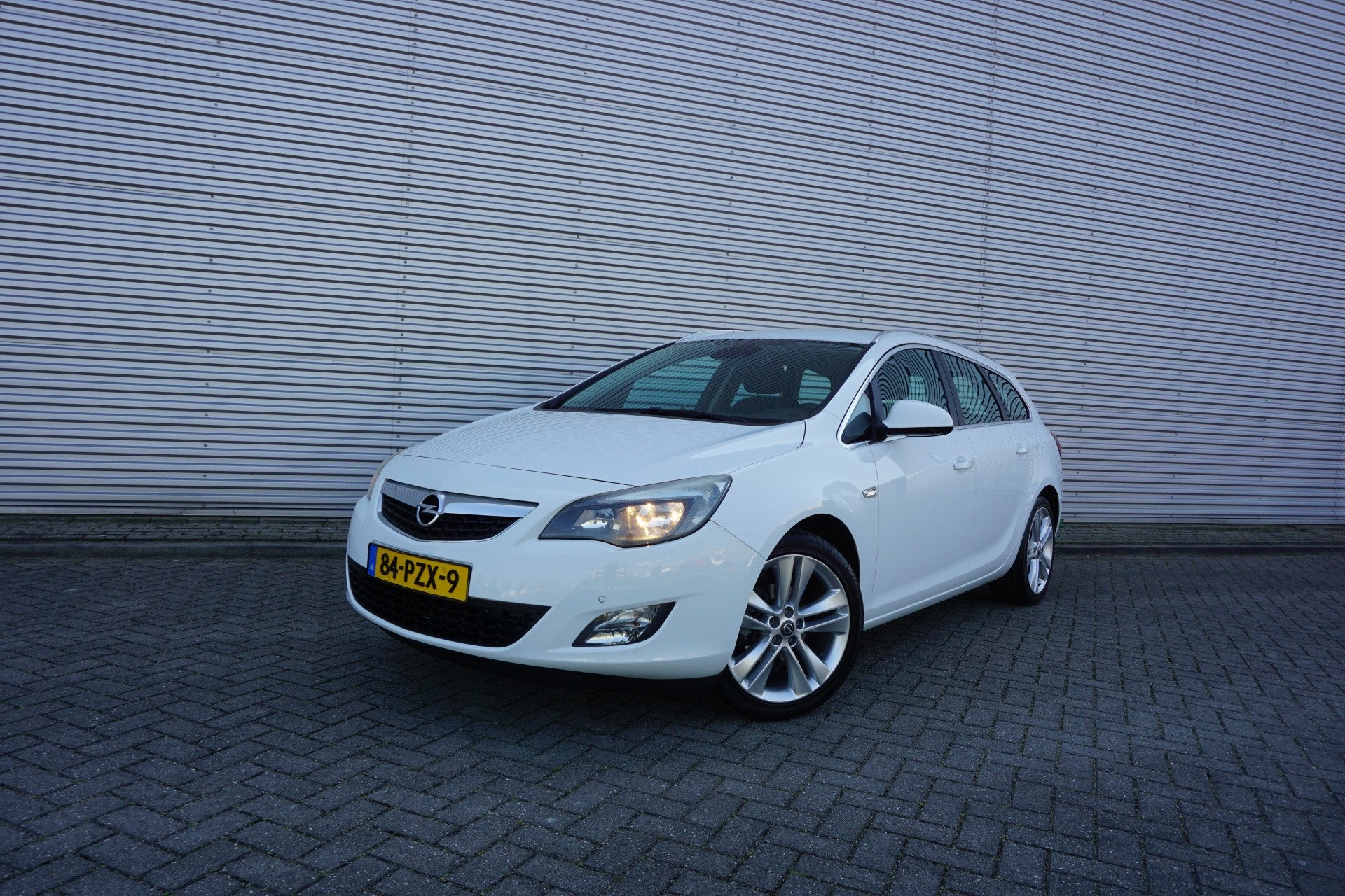 Opel Astra Sports Tourer 1.4 Turbo Sport Airco / Cruise / Na, Voorwielaandrijving, Euro 5, Gebruikt, 4 cilinders