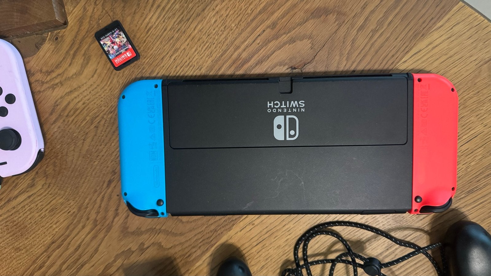 Foto 10 van Nintendo Switch Oled Model Zwart 8 maanden oud