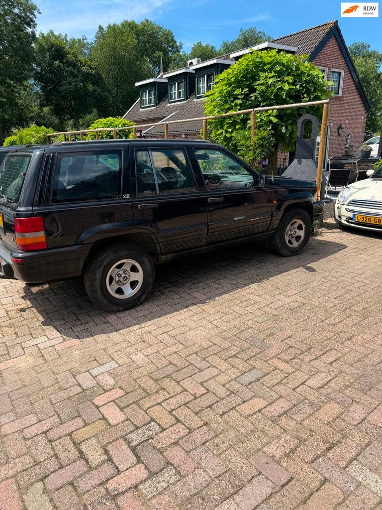 Jeep Grand Cherokee 5.2i V8 Limited loop of sloop, Auto's, Automaat, 8 cilinders, 4x4, Zwart