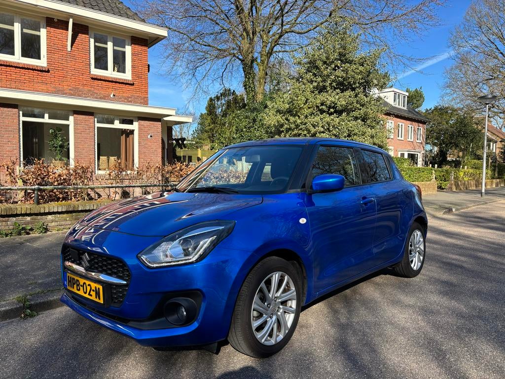 Suzuki Swift 1.2 83pk Smart Hybrid Automaat  2024 Blauw, Auto's, Suzuki, 83 pk, Stof, 4 cilinders, Swift