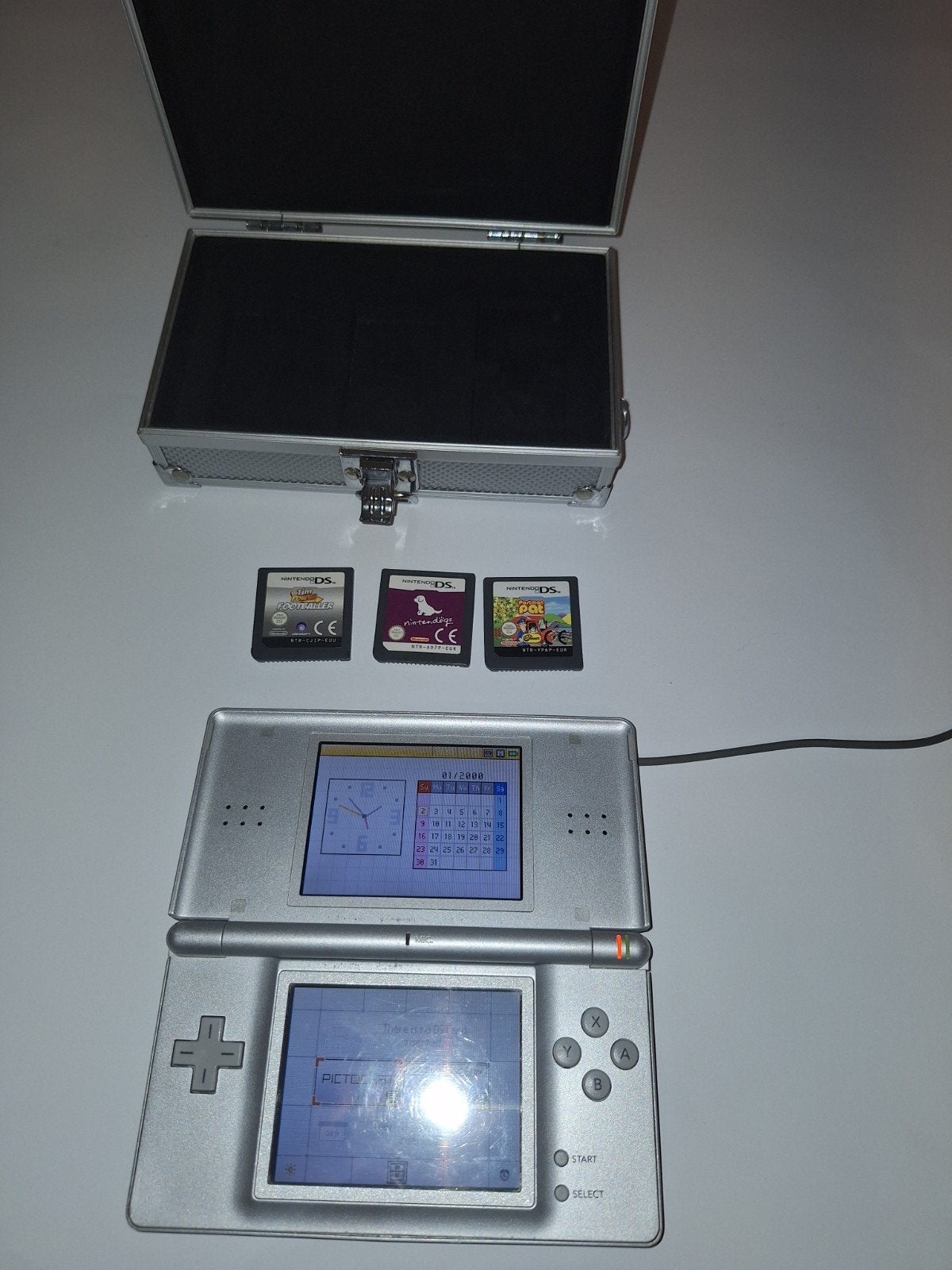 Grijze Nintendo DS Lite met lichte schermdefect en 3 games, Ophalen of Verzenden, Zilver, DS Lite, Gebruikt