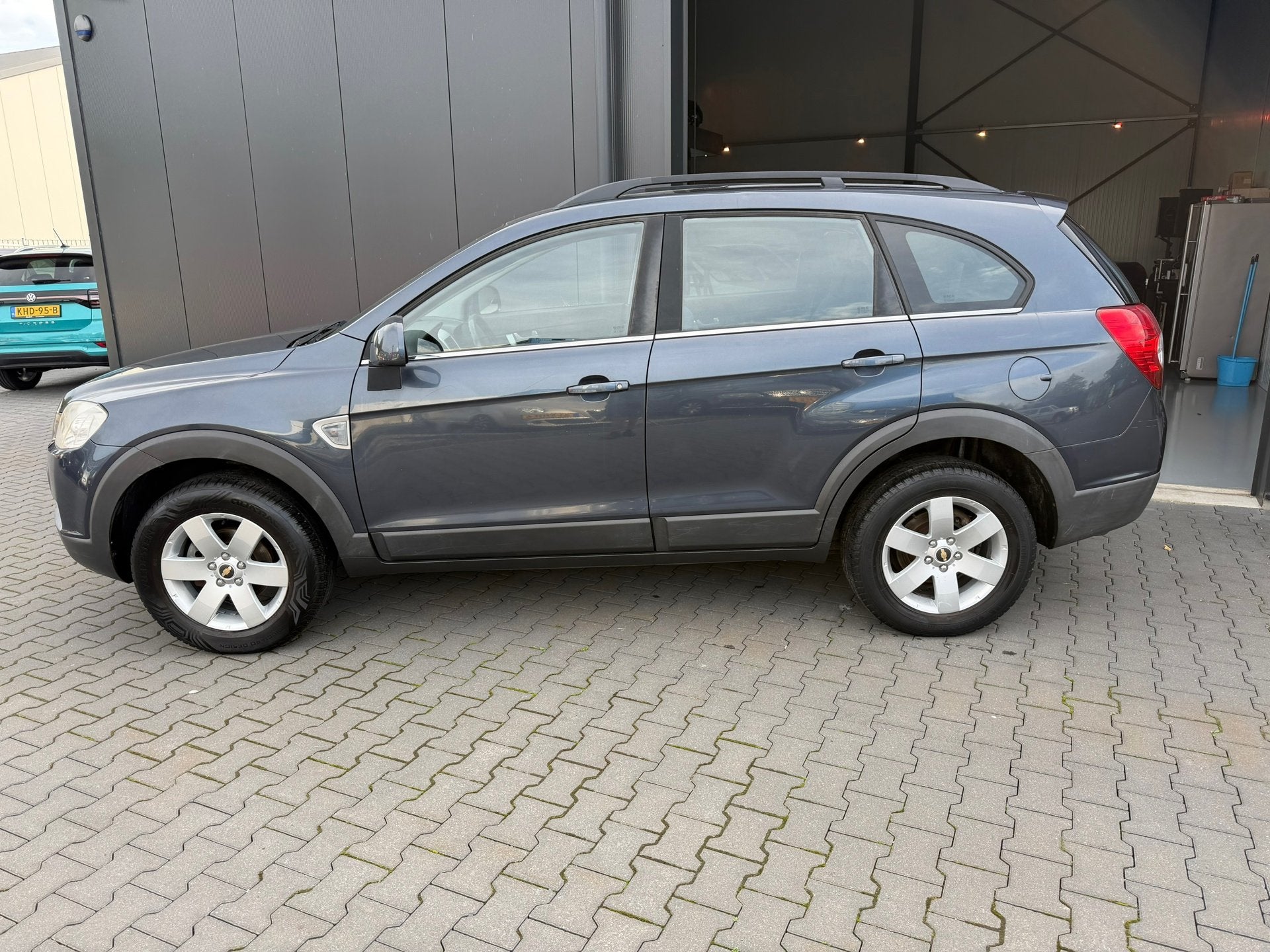 Chevrolet Captiva 2.4i Style 2WD 7 pers, Auto's, Stof, Gebruikt, Zwart, Bedrijf
