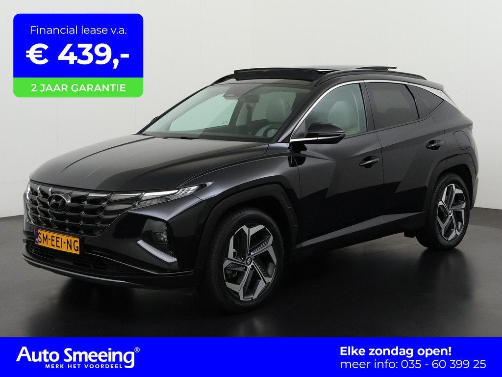 Hyundai Tucson 1.6 T-GDI PHEV Premium Sky 4WD | Panoramadak, Auto's, Hyundai, 14 kWh, Gebruikt, 4 cilinders, Zwart