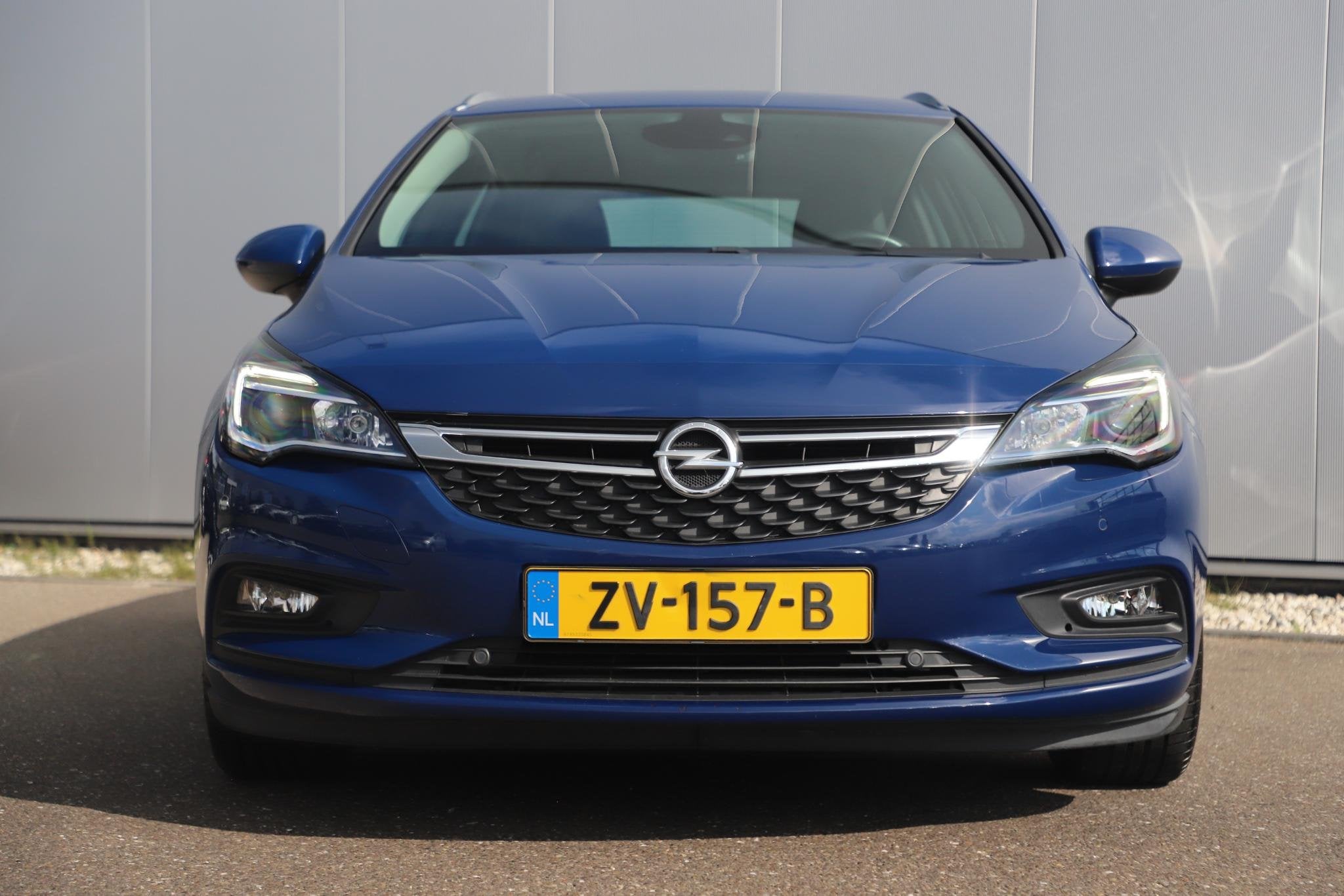 Opel Astra Sports Tourer 1.0 Turbo Business Executive 105PK, Stof, Gebruikt, 1178 kg, Met garantie (alle)
