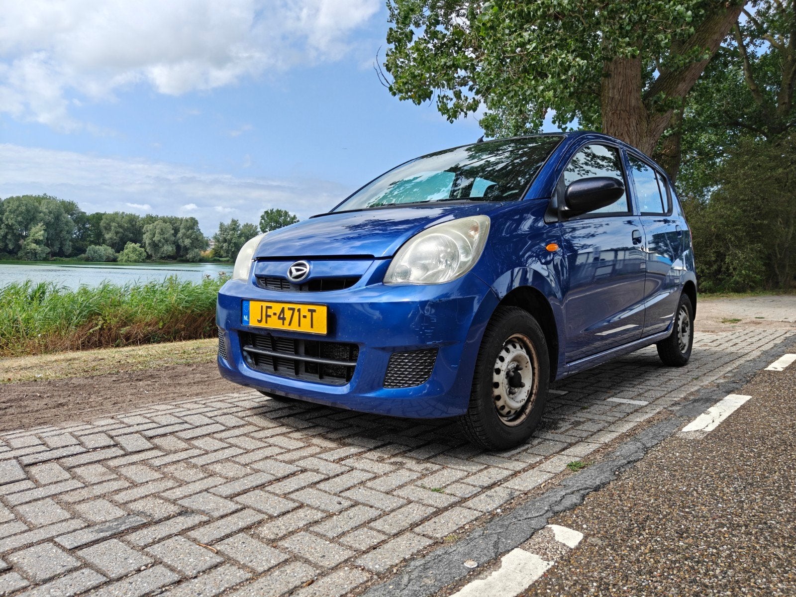Daihatsu Cuore 1.0 5D 2008 Blauw, Auto's, Daihatsu, Voorwielaandrijving, Stof, 600 kg, Zwart