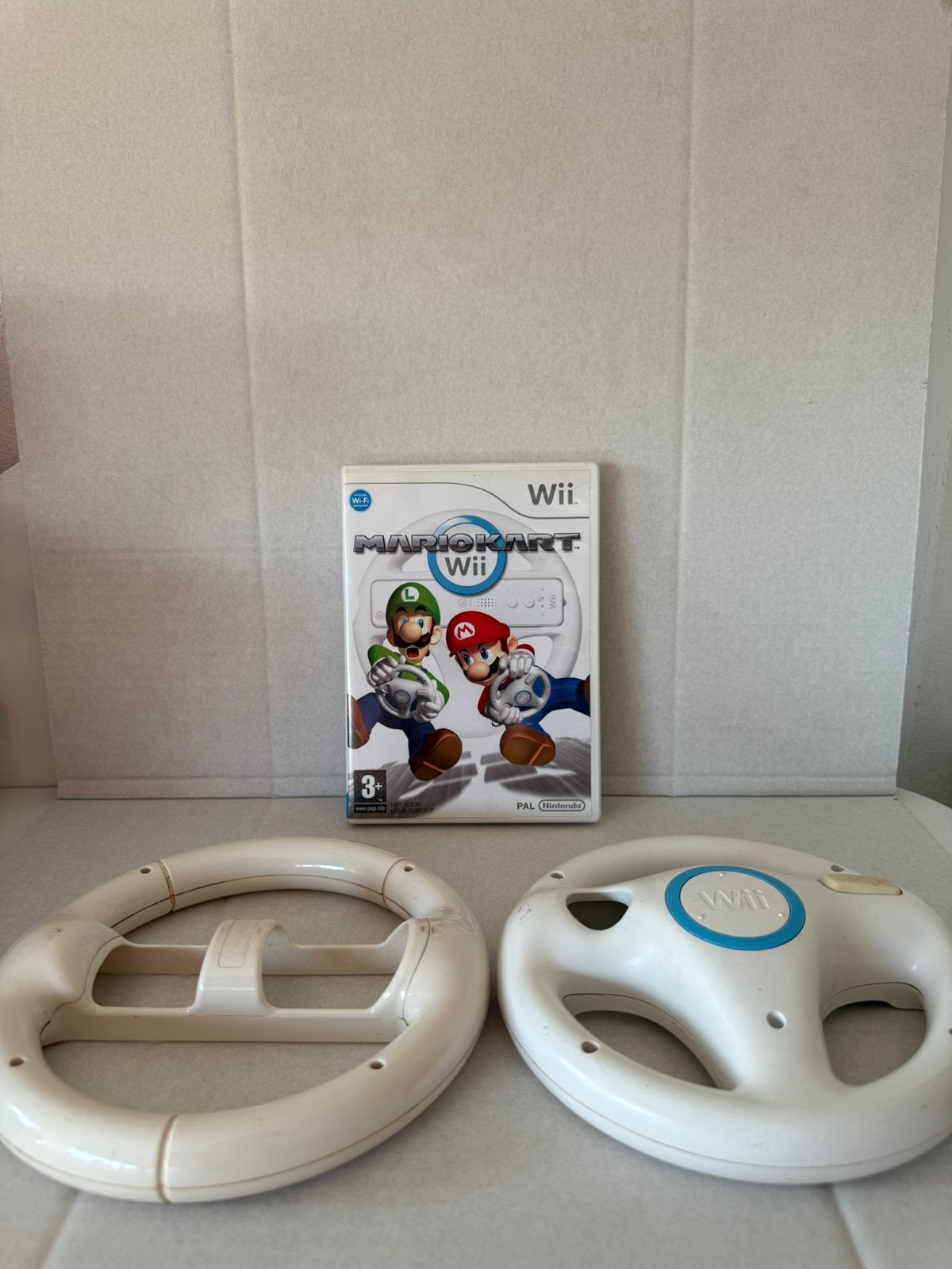 Mario Kart Wii + 2 stuurtjes!, Spelcomputers en Games, Racen en Vliegen, Ophalen of Verzenden, Zo goed als nieuw, 3 spelers of meer