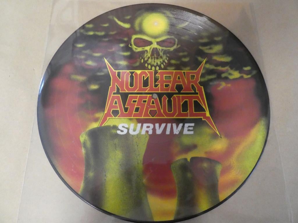 Nuclear Assault – Survive pic-lp (1988), Cd's en Dvd's, Vinyl | Hardrock en Metal, Picture disc, Verzenden, Zo goed als nieuw