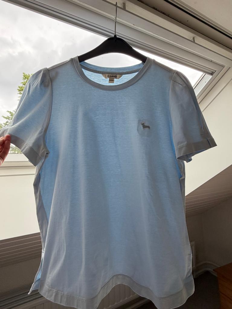 E. Land licht blauwe T-shirtje, goed als nieuw, maat 165, Ophalen of Verzenden, Zo goed als nieuw, Meisje, Shirt of Longsleeve