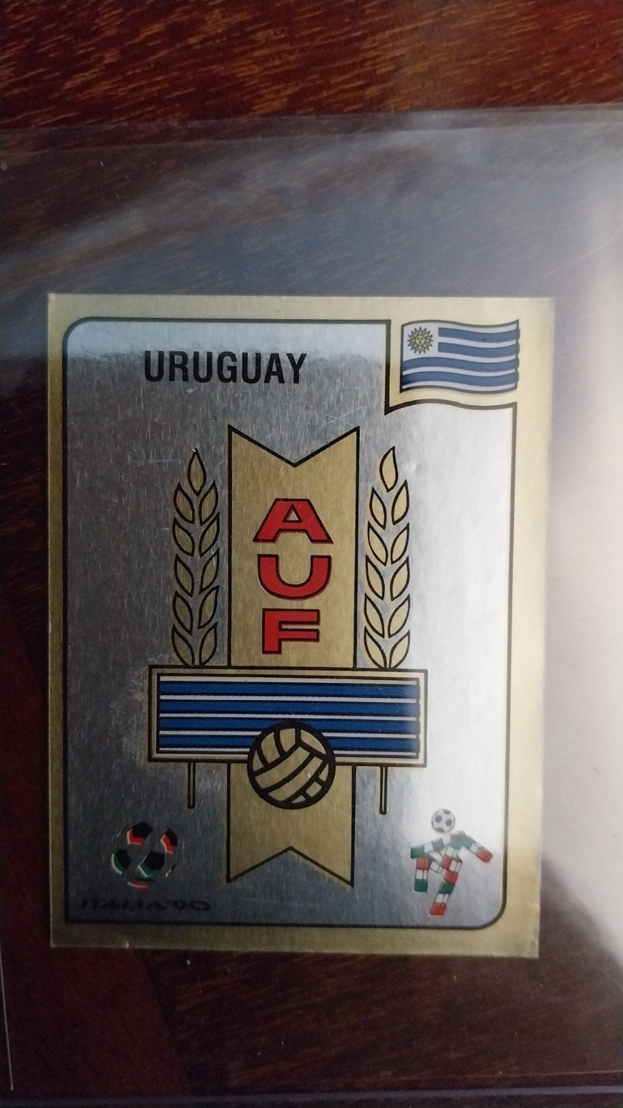 Panini Italia'90 sticker #363  - Embleem

URUGUAY, Verzamelen, Ophalen of Verzenden, Zo goed als nieuw, Buitenlandse clubs, Poster, Plaatje of Sticker