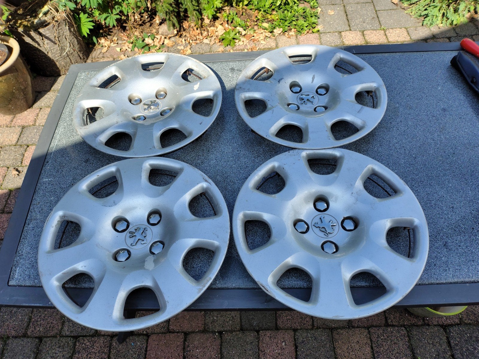 Set van 4 Peugeot wieldoppen, Auto diversen, Wieldoppen, Ophalen, Gebruikt