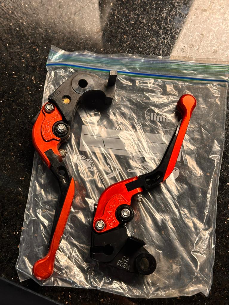Oranje motorfiets rem- en koppelingshendels, Motoren, Ophalen of Verzenden, Gebruikt