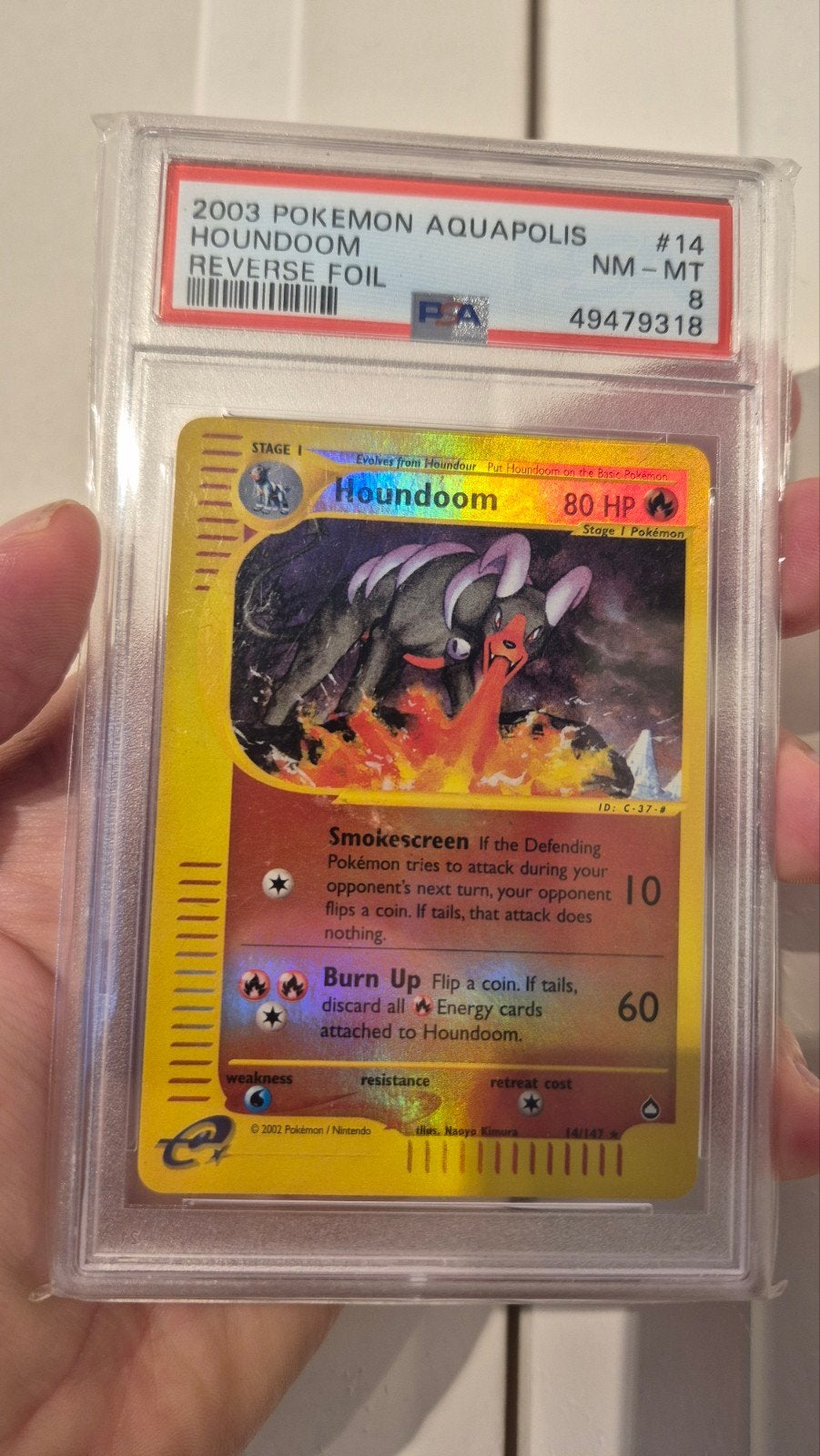 Houndoom 14/147 Aquapolis Reverse Foil PSA 8 Pokémon Kaart, Ophalen of Verzenden, Zo goed als nieuw, Losse kaart, Foil