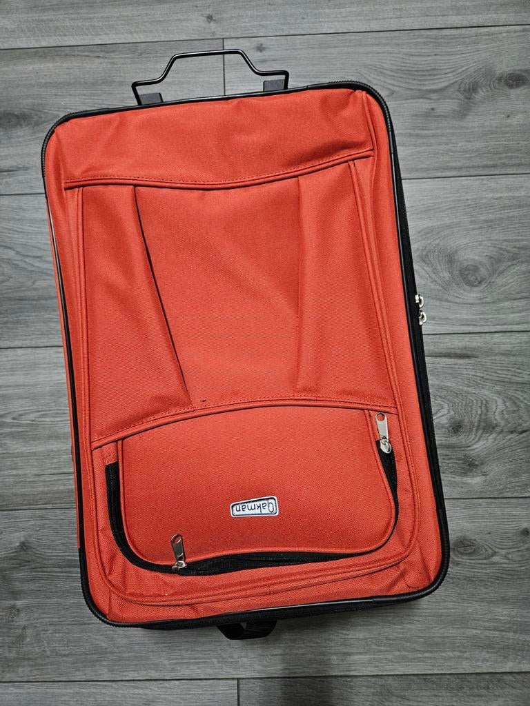 Oranje vakantie koffer, Ophalen