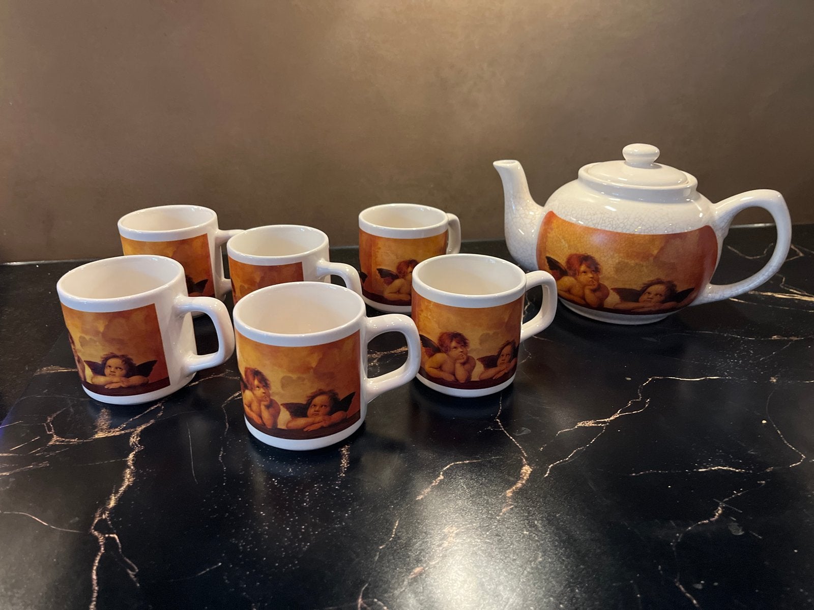 Theeservies met engeltjes van Rafaël (6 mokken + theepot), Huis en Inrichting, Keuken | Servies, Ophalen, Gebruikt, Overige merken