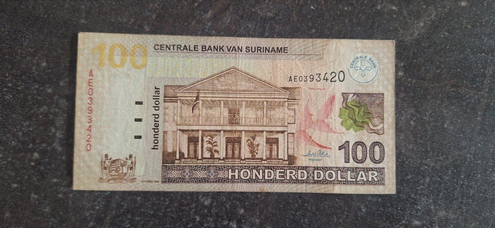 Suriname 100 Dollar november 2004 (Zeer zeldzaam. ), Postzegels en Munten, Bankbiljetten | Amerika, Ophalen of Verzenden, Zuid-Amerika