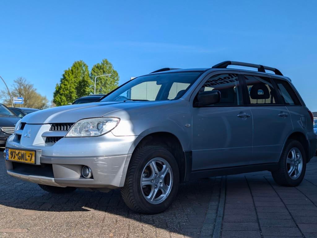 Mitsubishi Outlander Sport 2.0 Travel - Airco - Trekhaak - A, Auto's, Mitsubishi, Voorwielaandrijving, Zwart, 4 cilinders, 1415 kg