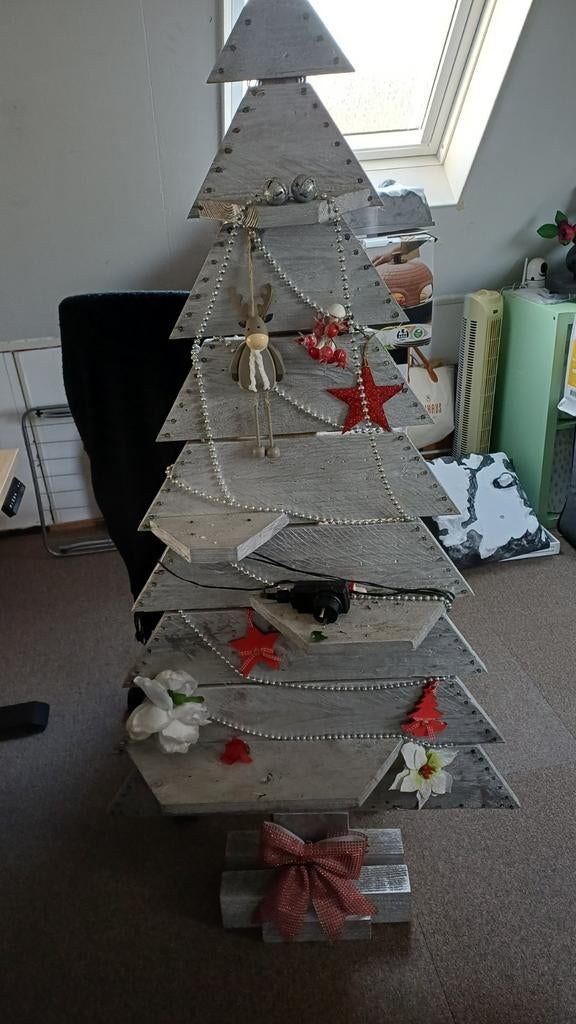 Houten kerstboom, Ophalen
