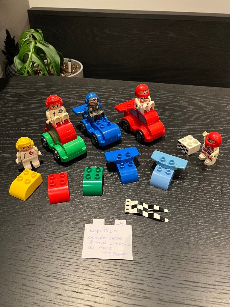 Heel goed Lego Duplo F1 race auto set (28st) minifiguren, Ophalen of Verzenden, Zo goed als nieuw, Duplo