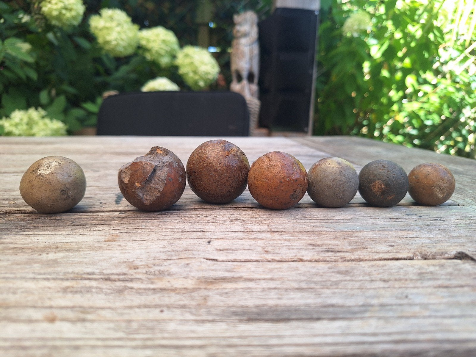 Set van 7 authentieke antieke kleiknikkers (kleipoepers), Ophalen