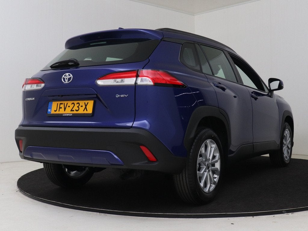 Toyota Corolla Cross Hybrid 140 Active (bj 2025, automaat), Auto's, Toyota, 12 maanden, Stof, Blauw, Stoelverwarming