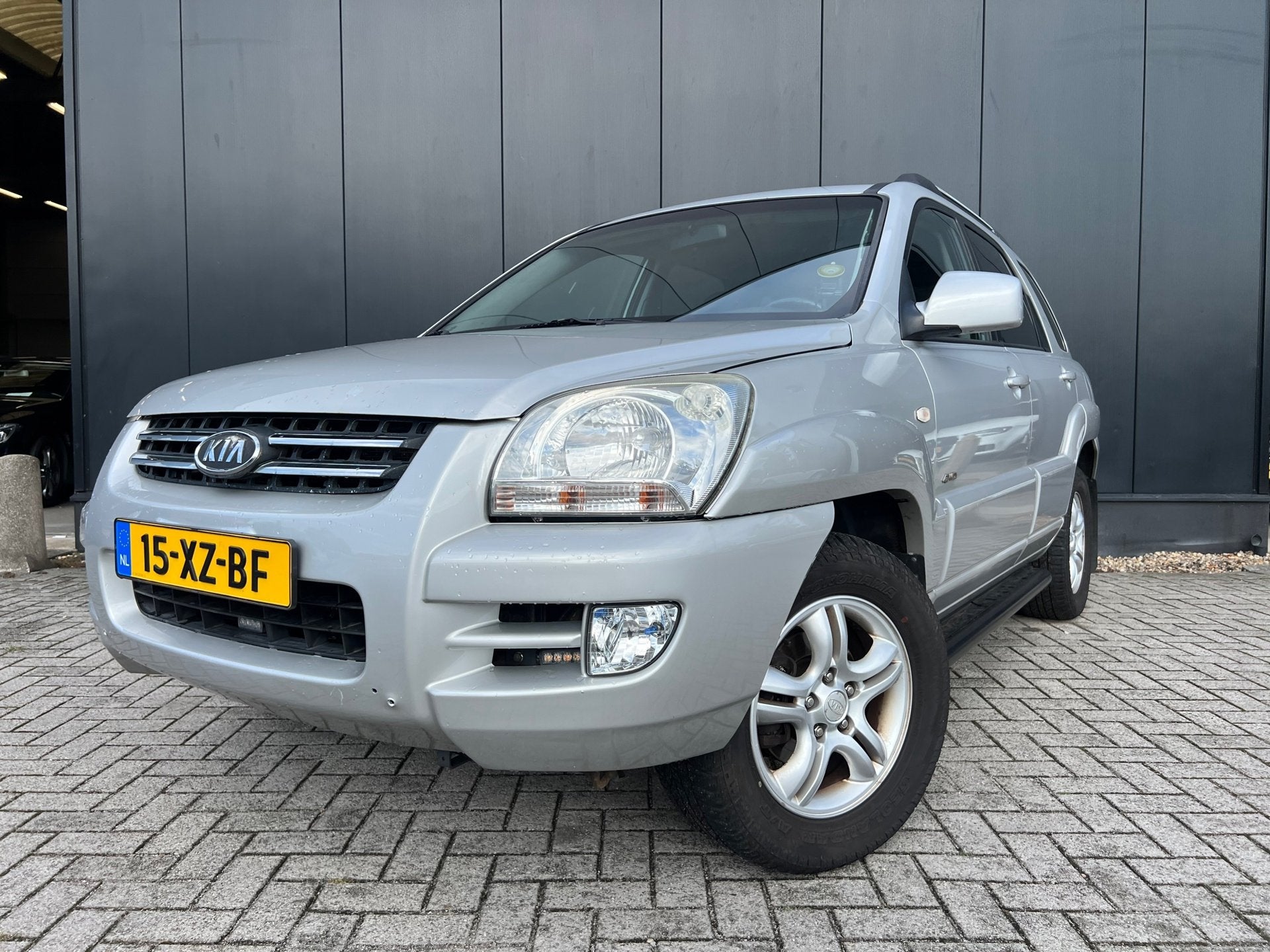 Kia Sportage 2.7 V6 4WD Aut/Leer/Carplay/Nwdistributie, Auto's, Automaat, Gebruikt, Zwart, 2656 cc