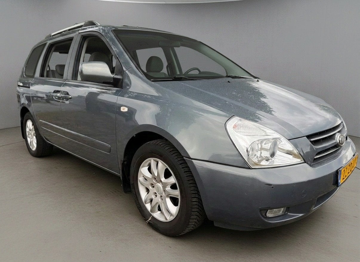 Kia Carnival 2.7 EX Automaat|Clima|Cruise|Leder|7P|Nap!, Auto's, Gebruikt, Stoelverwarming, 2000 kg, 120 €/maand