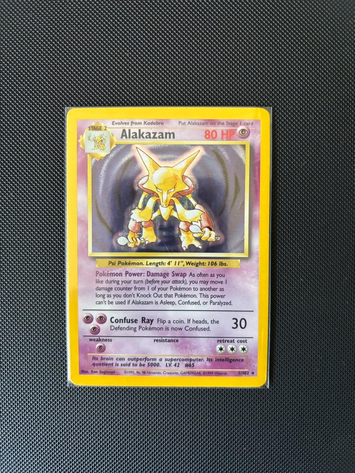 Alakazam 1/102 Base Set Holo, Hobby en Vrije tijd, Verzamelkaartspellen | Pokémon, Ophalen of Verzenden, Gebruikt, Losse kaart