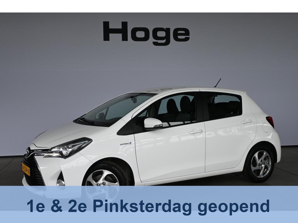 Toyota Yaris 1.5 Hybrid Trend Bi-Tone Clima Navigatie Trekha, Gebruikt, 4 cilinders, Bedrijf, Hybride Elektrisch/Benzine