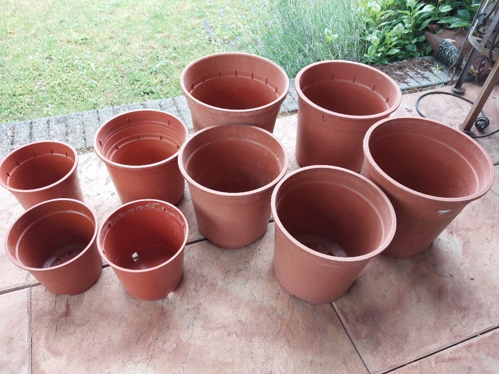 9 Kunstof terracotta kleurige Bloempotten Set, Tuin en Terras, Bloempotten, Kunststof, Rond, Ophalen of Verzenden, Zo goed als nieuw
