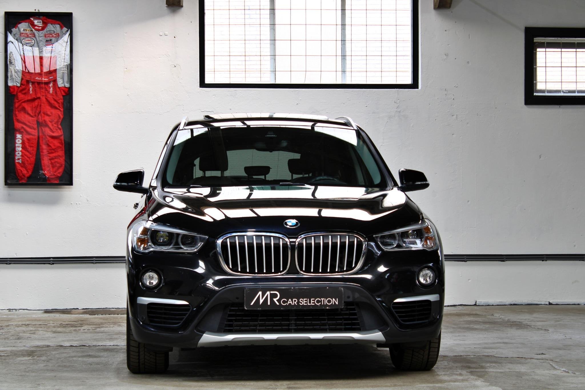 BMW X1 sDrive20i Orange Edition II | X-Line | Panoramadak |, 1998 cc, Met garantie (alle), Zwart, SUV of Terreinwagen
