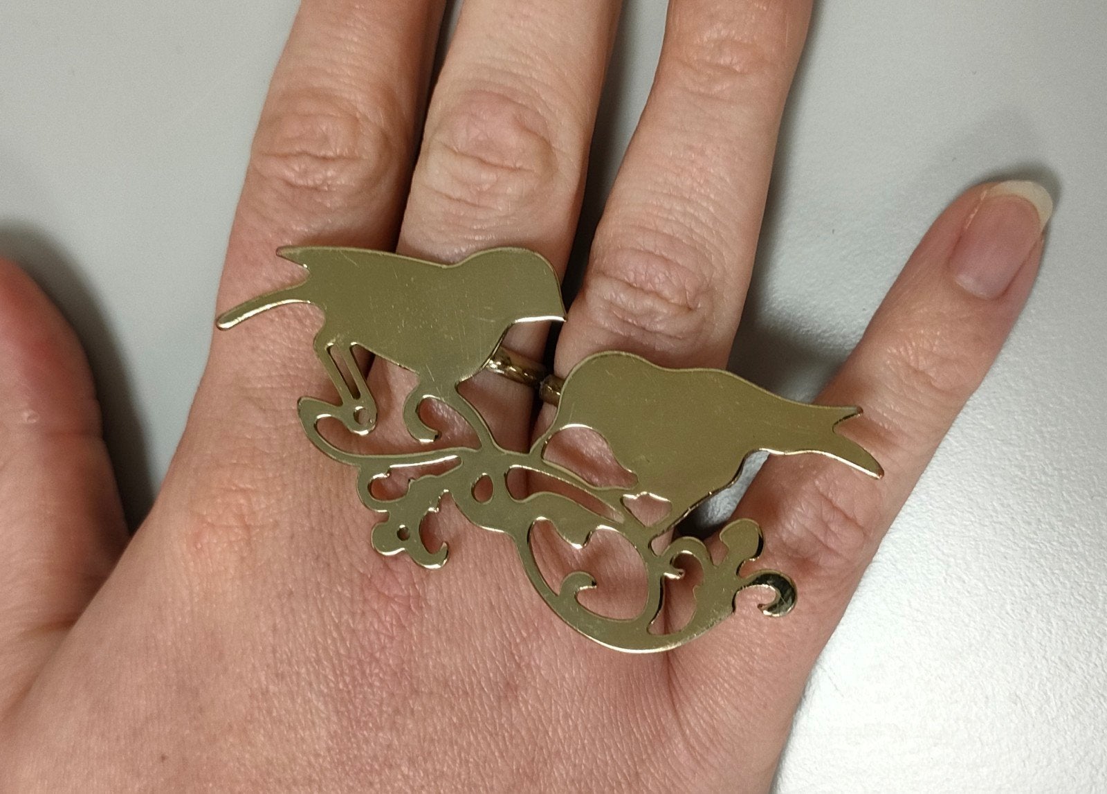 Opvallende goudkleurige dubbele verstelbare vogel ring, Ophalen of Verzenden, Zo goed als nieuw, IJzer of Staal, Dame