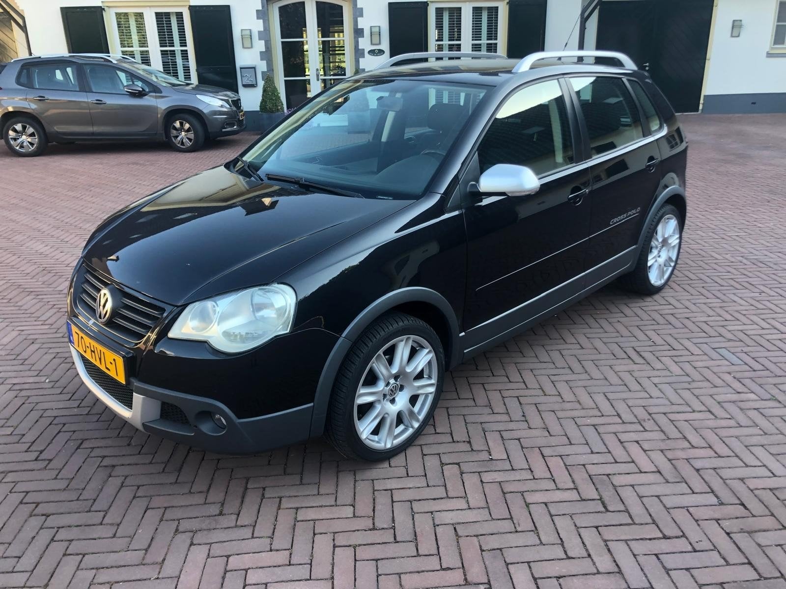 Volkswagen Cross Polo 1.4 16V 59KW Cross 2009 Zwart, Voorwielaandrijving, 15 km/l, Metallic lak, Leder en Stof