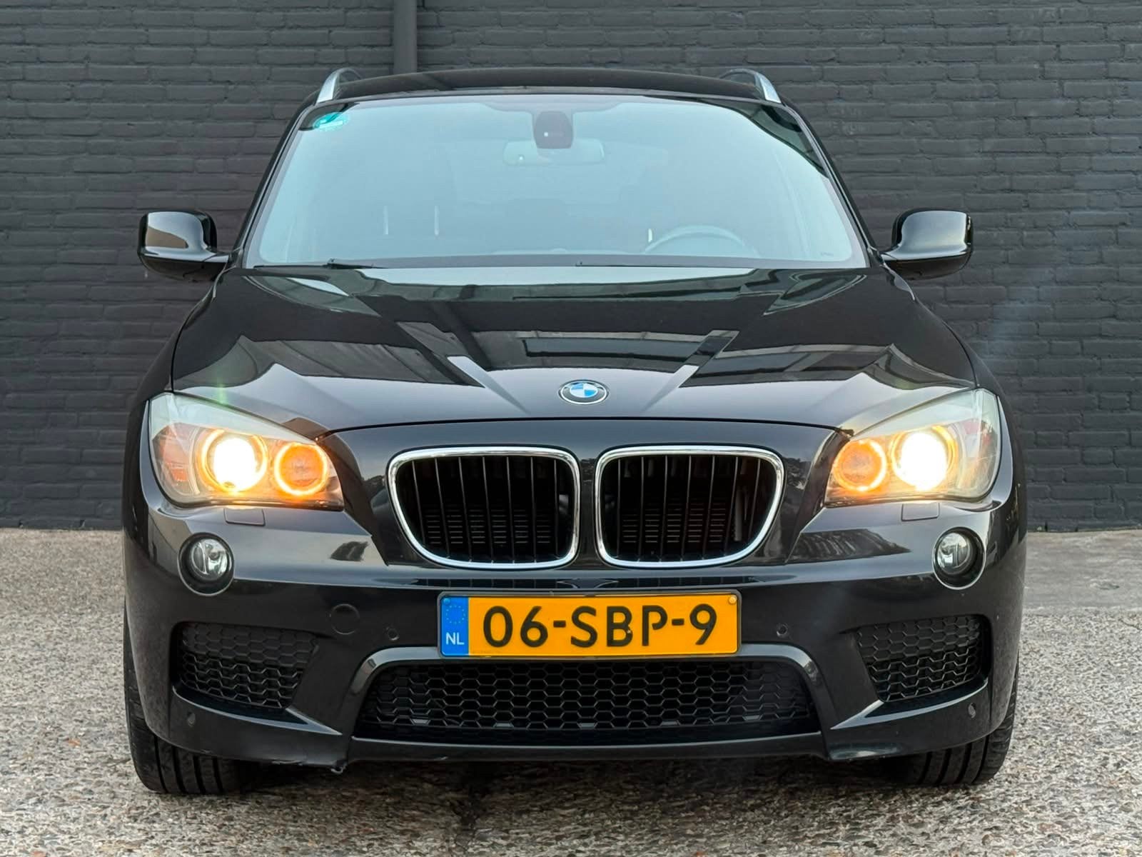 BMW X1 SDrive18i M SPORTPAKKET|NAVI|AIRCO|PDC|TREKHAAK|ELEK, Auto's, BMW, X1, Euro 5, Zwart, 150 pk