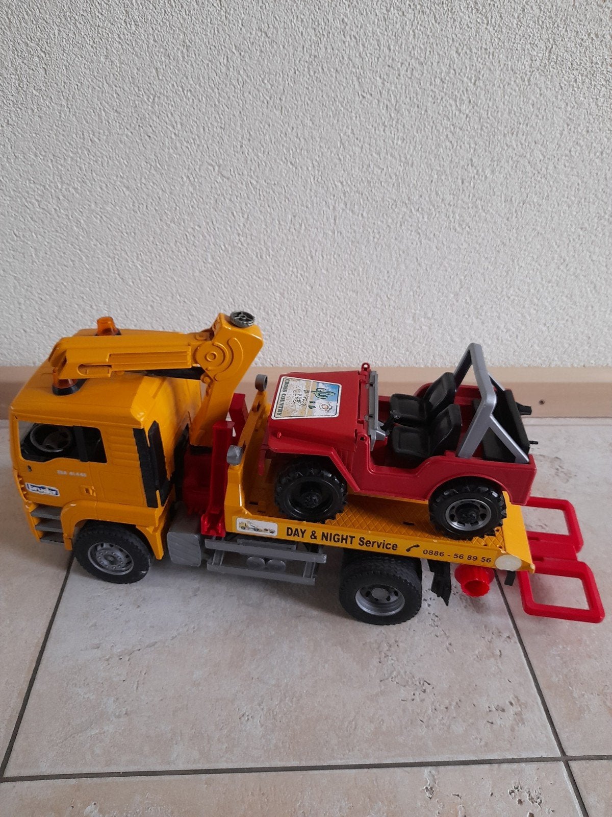 bruder sleepwagen met auto, Ophalen