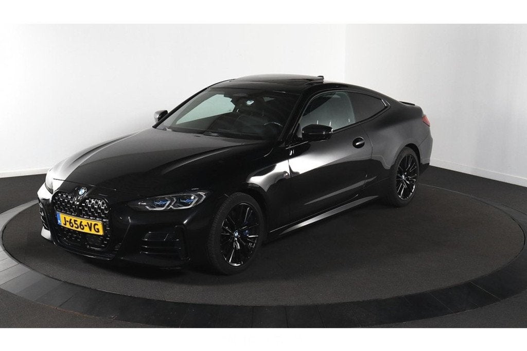 BMW M4 40i xDrive High Executive (bj 2020, automaat), Auto's, BMW, Automaat, Gebruikt, 4 stoelen, Zwart