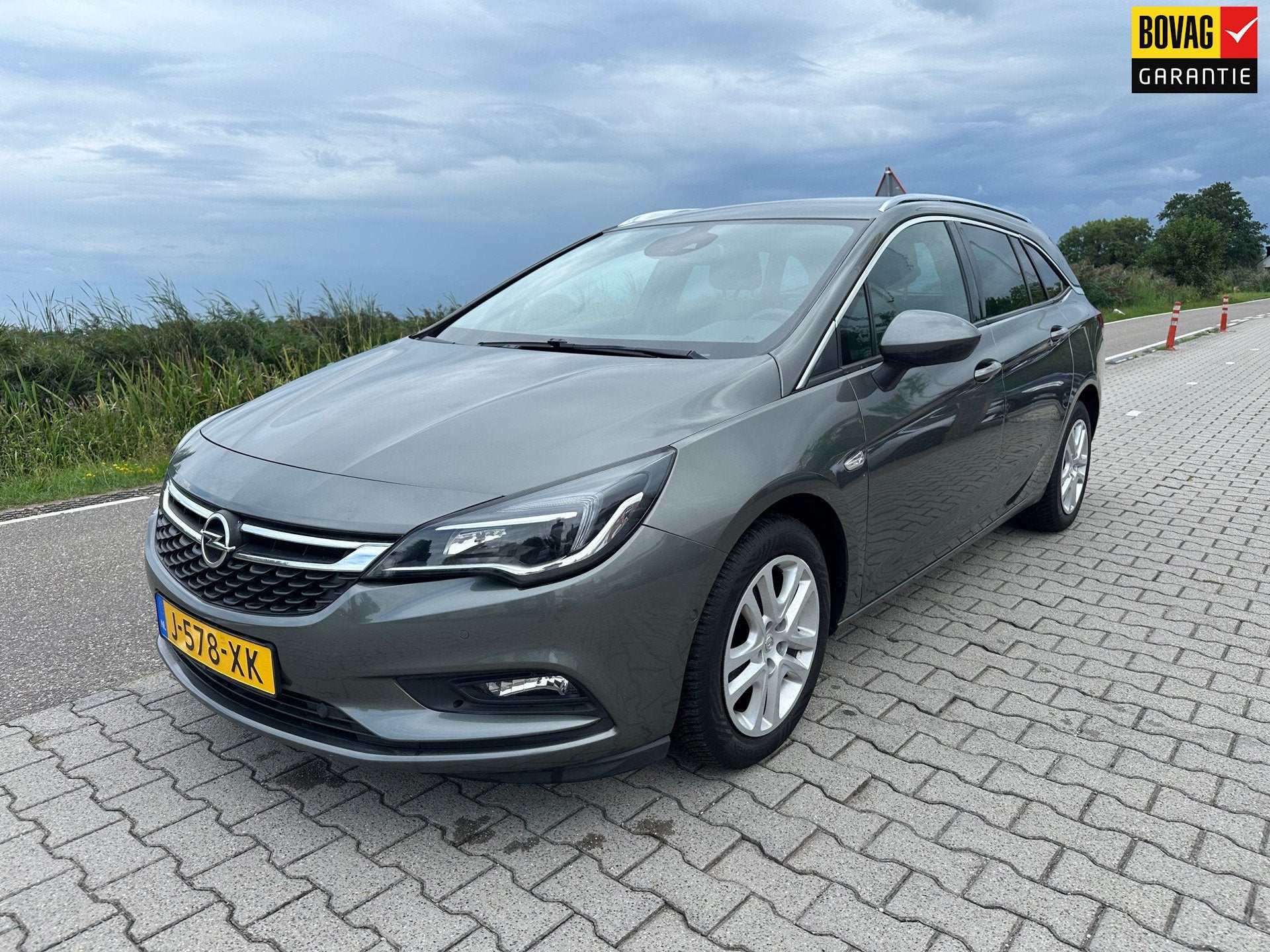 Opel Astra Sports Tourer 1.4 Turbo Innovation, Carplay, Trek, Automatische klimaatregeling, Gebruikt, Euro 6, Leder en Stof