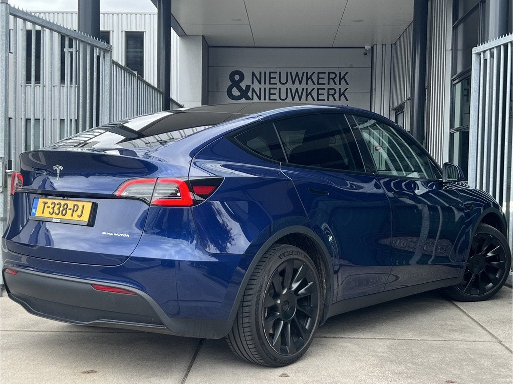 Tesla Model Y Long Range AWD 75 kWh (bj 2023, automaat), Auto's, Tesla, Gebruikt, Huisgarantie, Met garantie (alle), Blauw