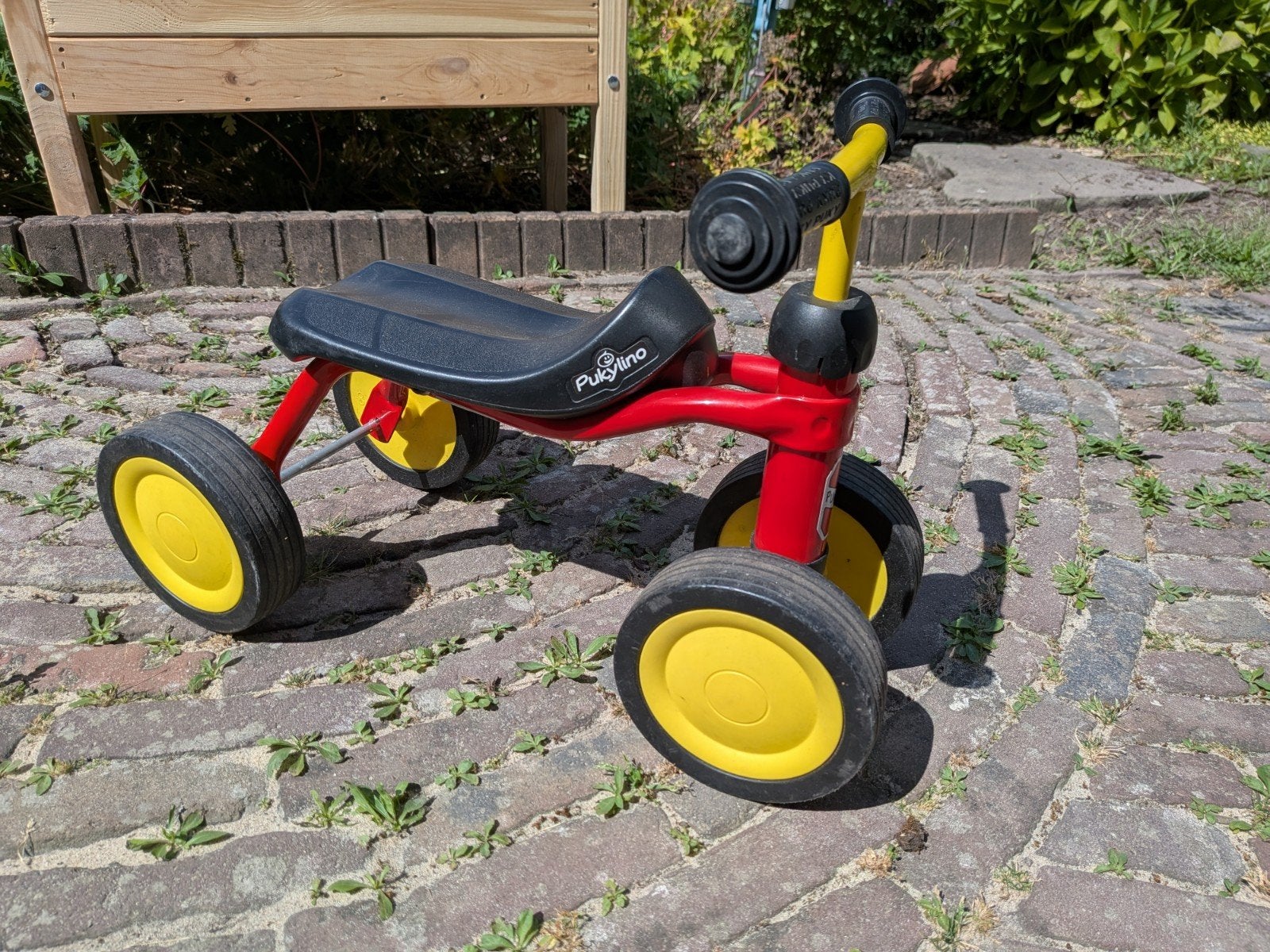 Pukylino loopfietsje rood/geel vierwieler, prima staat, Ophalen, Gebruikt, Loopfiets