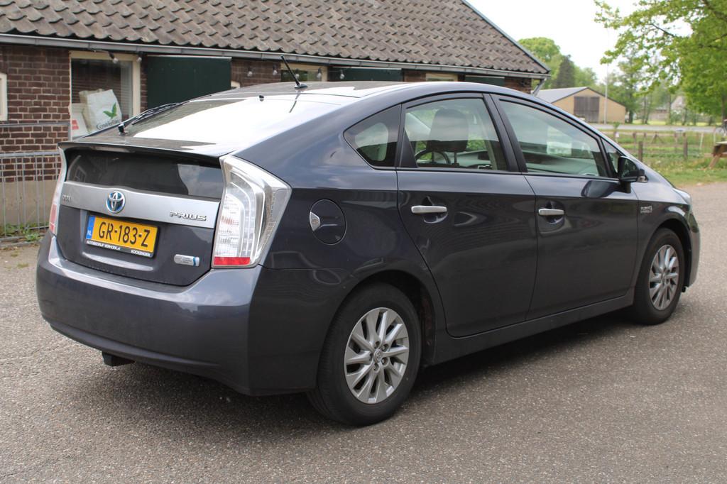 Toyota Prius 1.8 Plug-in Aspiration HUD CRUISE NAVI CAMERA P, Auto's, Toyota, Stof, Gebruikt, Blauw, Stoelverwarming