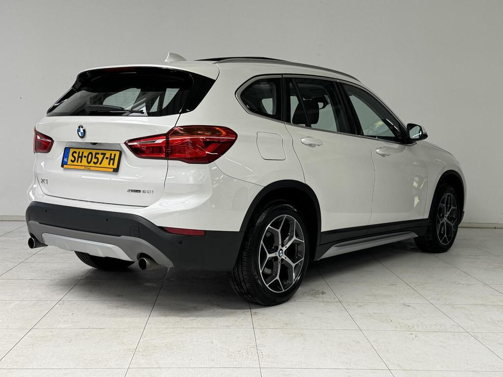 BMW X1 sDrive20i High Executive | Panoramadak | Trekhaak | L, Auto's, BMW, 1998 cc, Met garantie (alle), Wit, 1455 kg