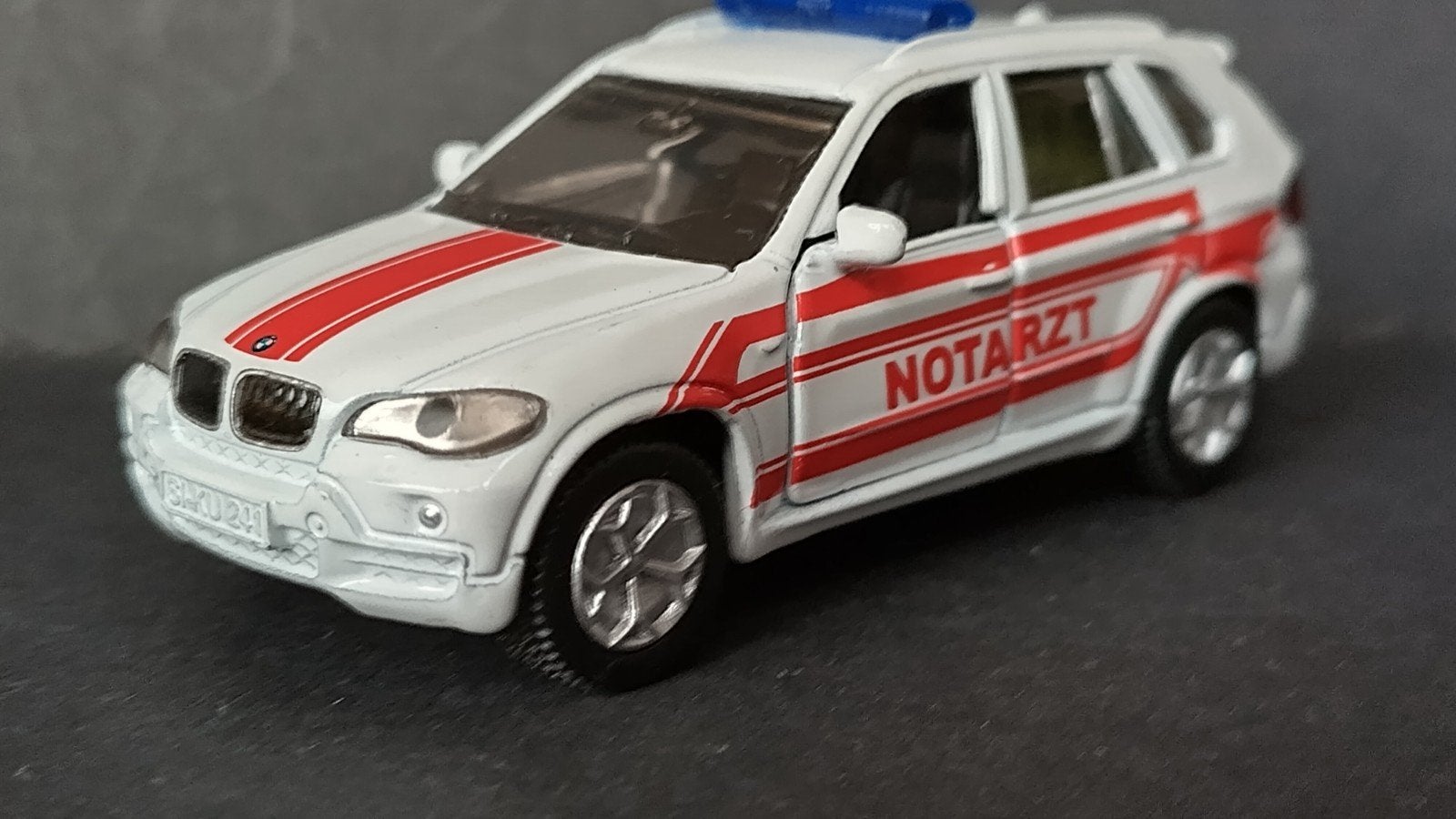 Bmw X5 4.8 Notarzt 1:55 Siku Pol, Hobby en Vrije tijd, Auto, Ophalen of Verzenden, Zo goed als nieuw, Sieper