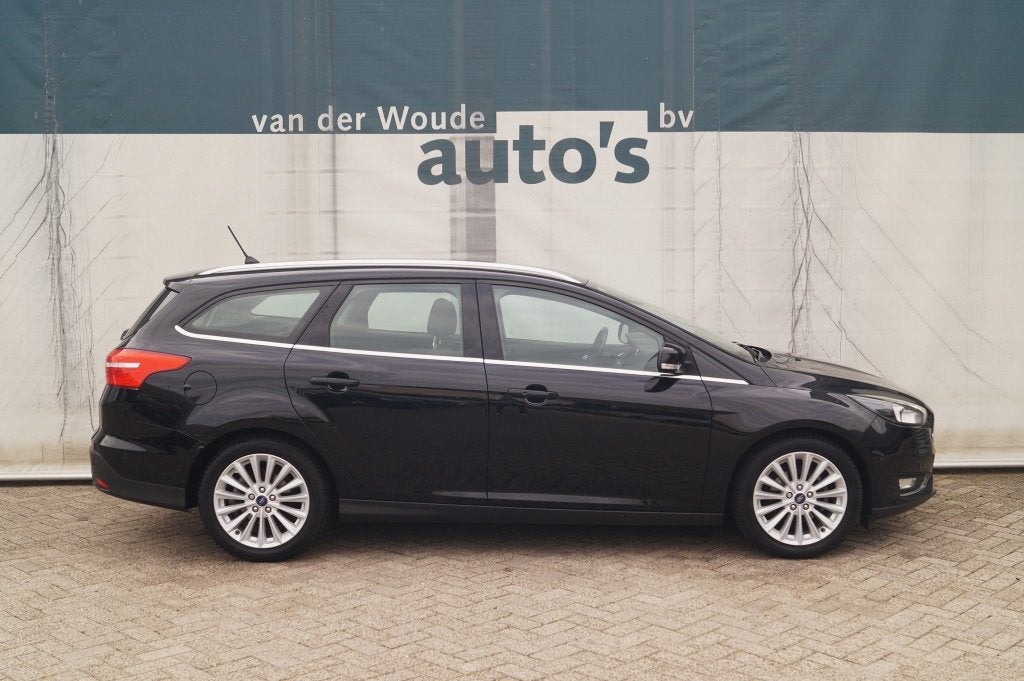 Ford Focus Wagon 1.0 125pk Titanium -NAVI-ECC-PDC-CAM-TREKHA, Gebruikt, Euro 6, Zwart, Origineel Nederlands