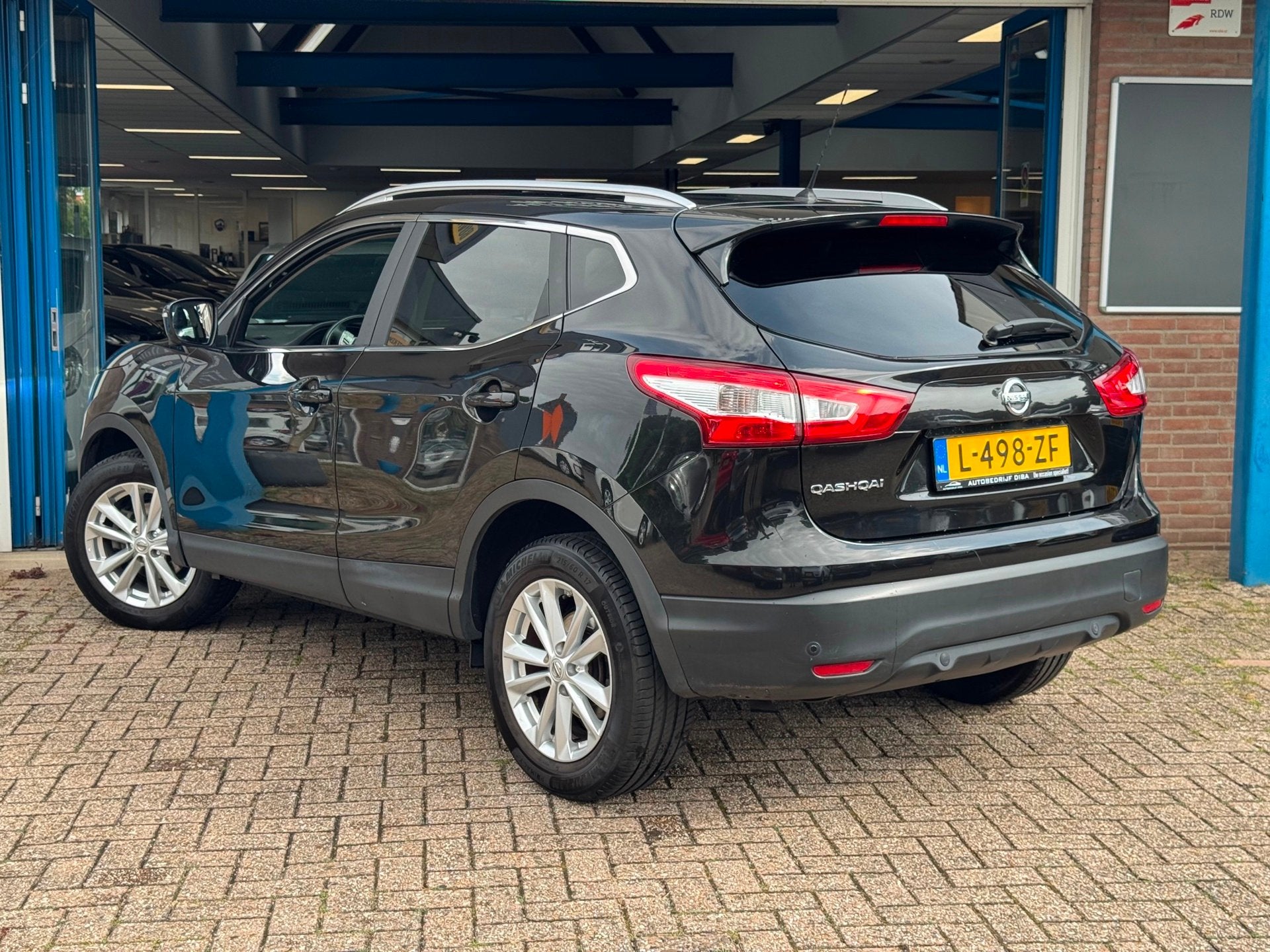 Nissan Qashqai 1.2 Acenta 2015 NAVI CLIMA LEDER CAMERA NAP, Auto's, Voorwielaandrijving, Gebruikt, Zwart, 4 cilinders