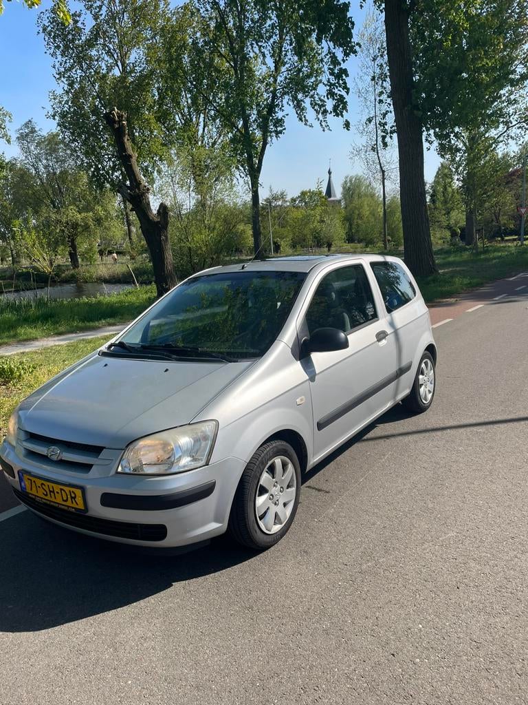 Hyundai Getz 1.1 2006 Grijs, Auto's, Voorwielaandrijving, 63 pk, 31 €/maand, 4 cilinders