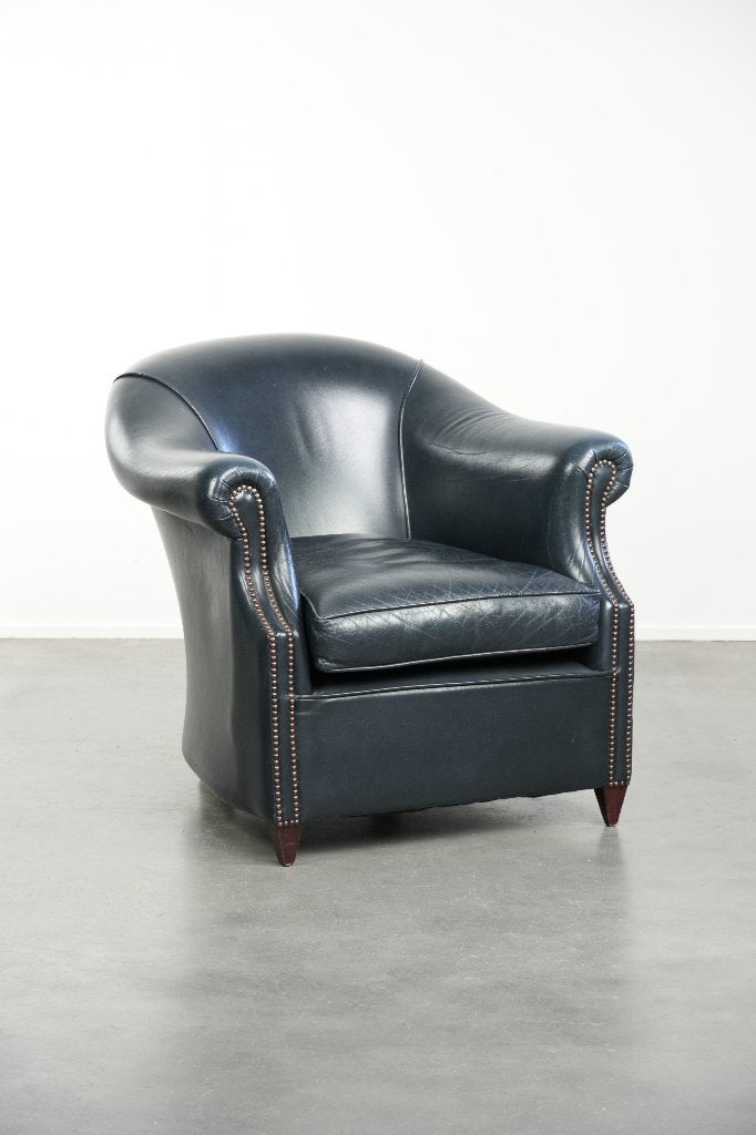 Comfortabele donkerblauwe rundleren clubfauteuil, Ophalen