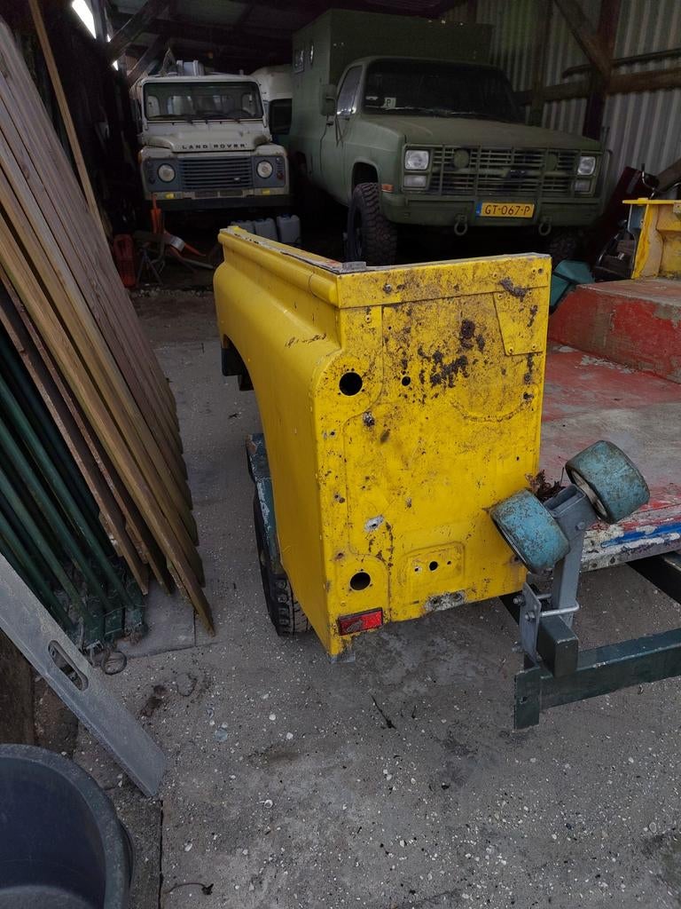 Defender 110 reartub geel, Ophalen, Spatbord, Achter, Gebruikt